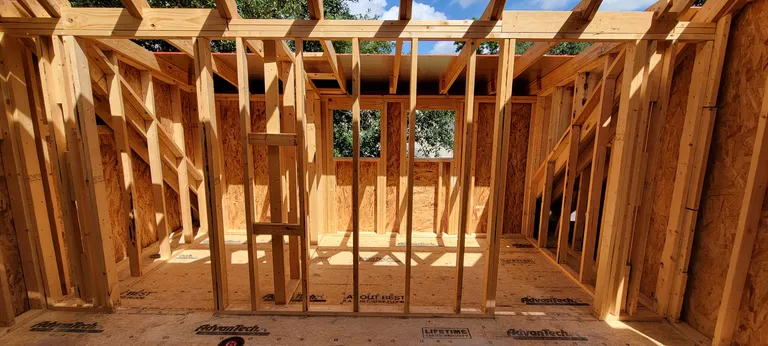 Window and dormer openings framed, with the headers in over each one.