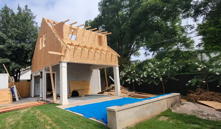 A second storey framed and sheathed over the existing garage.