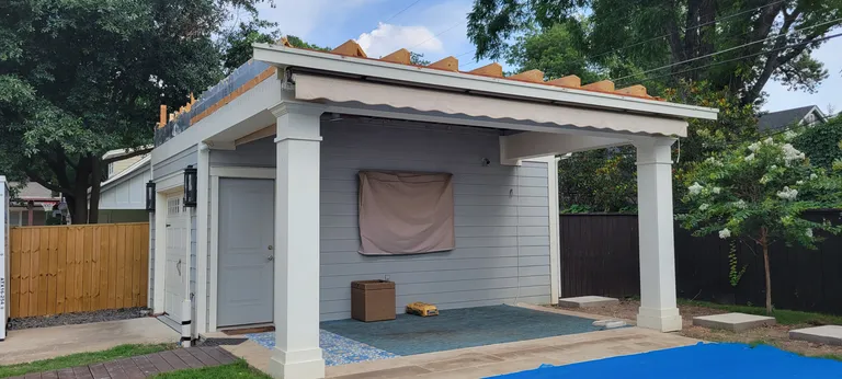 The existing garage and carport, before any work. The apartment goes on top of it.