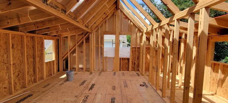Upstairs, with the ceiling vaulted into the roof rather than flattened below it.